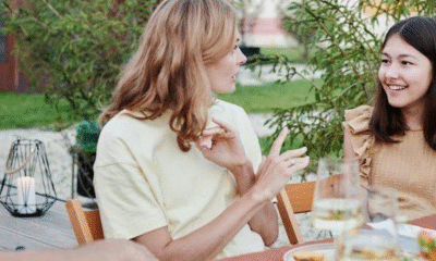 two women eating out and talking